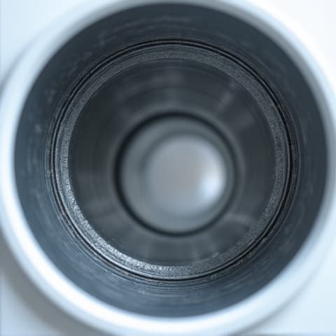 A clear view inside a professionally cleaned dryer vent duct, showing a smooth, unobstructed pathway for air, dramatically reducing fire risk and improving drying times in Sacramento.