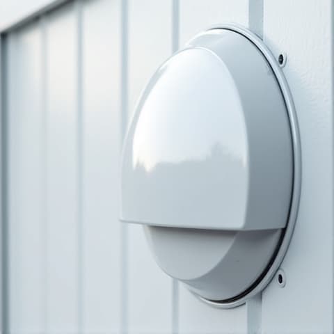 The exterior dryer vent cover before cleaning, showing visible lint blockage and discoloration that restricts airflow and reduces dryer efficiency in a Sacramento home.
